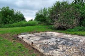 The charred remains of the classroom's concrete base at Flag Fen.