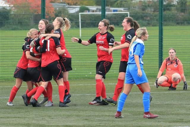 Netherton celebrate their winning goal against Knowle. Photo: Roger Ellison.
