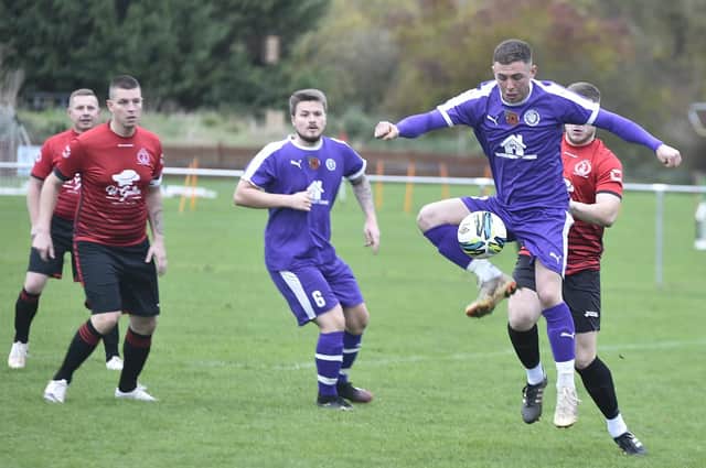 Action from Polonia's 6-3 win over Stanground Sports (purple). Photo: David Lowndes.