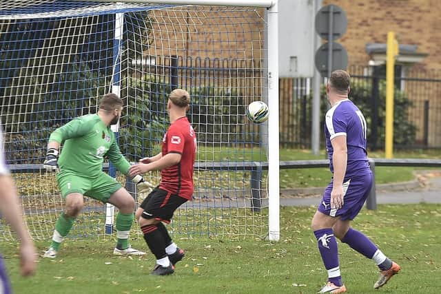 Polonia's second goal in a 6-3 win over Stanground Sports (purple). Photo: David Lowndes.
