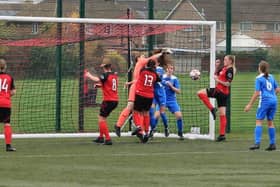 Action from Netherton United (red) v Knowle in the first round of the Women's FA Cup. Photo: Riger Ellison.