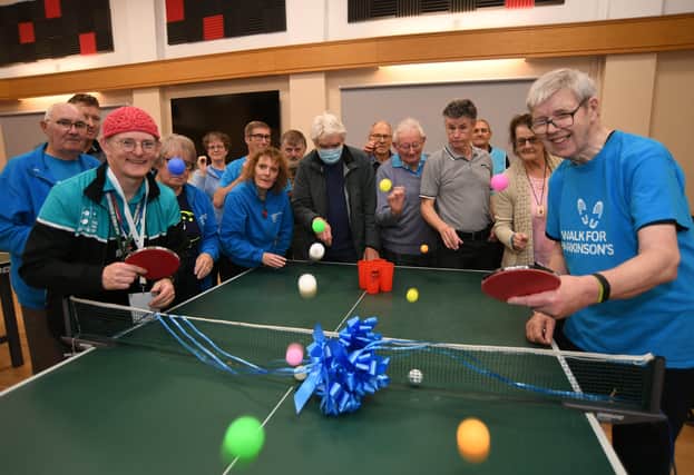 Andy Cassey (head of Parkinson's table tennis clubs) and Graham Wild (a local volunteer) with club members at the launch of the Peterborough Parkinson's Ping Pong club at the Salvation Army Citadel, Bourges Boulevard EMN-211211-162535009