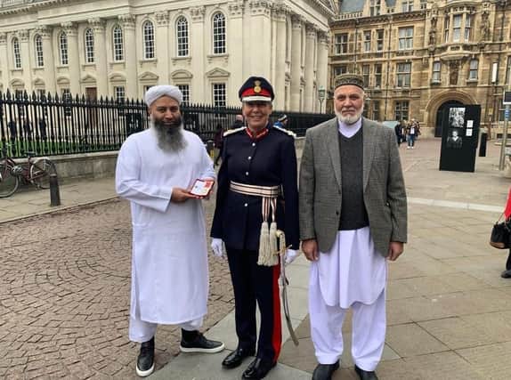 Mohammed Saeed with his father Mohammed Yasin and Lord-Lieutenant of Cambridgeshire, Mrs Julie Spence OBE QPM