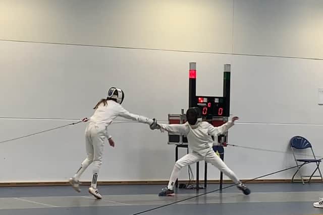 Isaballa Howser (left) during the fencing discipline.
