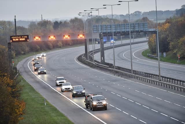 The A1M closed between Norman Cross and Sawtry due to lorry fire .