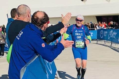 Bryan Smale is cheered home by spectators in Spain.