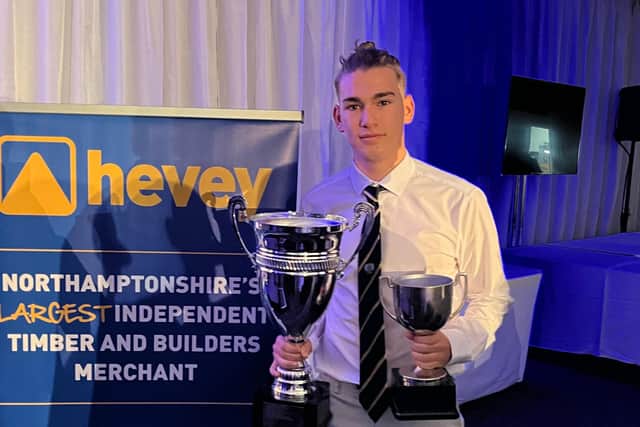 Sam Jarvis with the Northants League young player of the year prize.