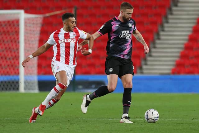 Mark Beevers of Peterborough United in action with Jacob Brown of Stoke City. Photo: Joe Dent/theposh.com.
