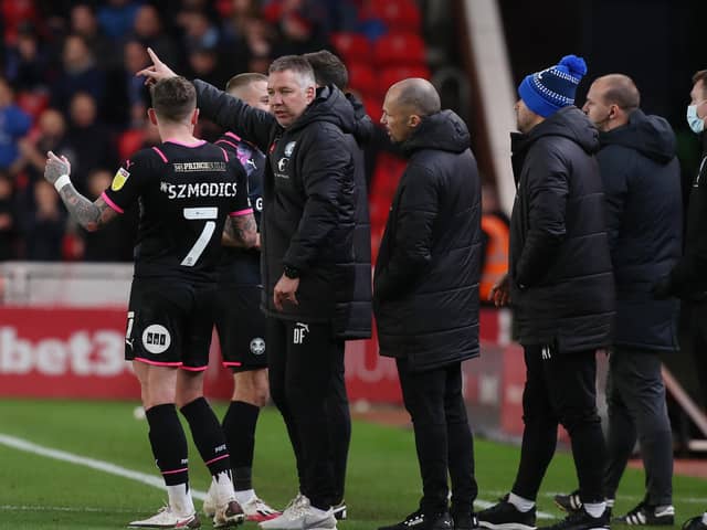 Peterborough United Manager Darren Ferguson issues instructions to Sammie Szmodics during a break in play at Stoke. Photo: Joe Dent/theposh.com