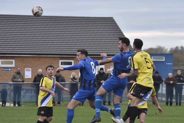 Whittlesey Athletic (blue) v Worcester City at Feldale Field.  Photo: David Lowndes.