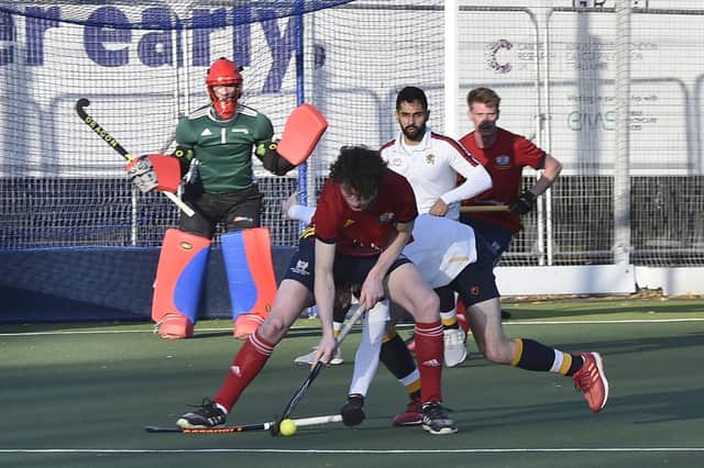 Matt Goodley (red) on the ball for City of Peterborough against Birmingham University. Photo: David Lowndes.