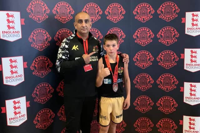 Santino Harris with coach Akif Shirazi.