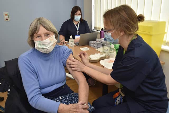 Mass vaccination centre at the City Care Centre, Thorpe Road. Jill Plant receives her jab from Dr Gillian Mitchell. EMN-210127-141653009