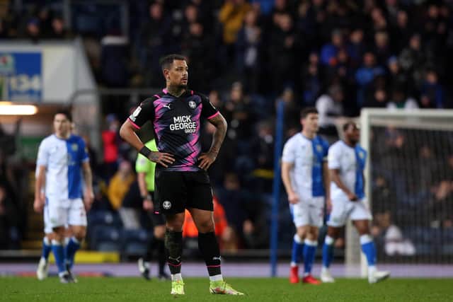 Jonson Clarke-Harris of Peterborough United cuts a dejected figure after Blackburn Rovers score their fourth goal. Photo: Joe Dent/theposh.com.