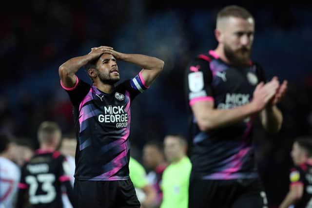 Posh players Nathan Thompson and Dan Butler after the 4-0 defeat at Blackburn. Photo: Joe Dent/theposh.com.