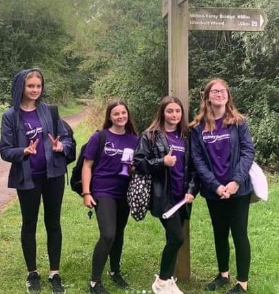 The team took part in a 6km walk around Ferry Meadows to fundraise.