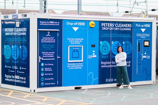 Vicky Whiter outside one of the dry cleaning pods.