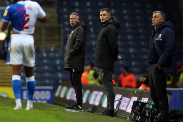 Peterborough United manager Darren Ferguson (left) watches his side play Barnsley last weekend. Photo: Joe Dent/theposh.com.