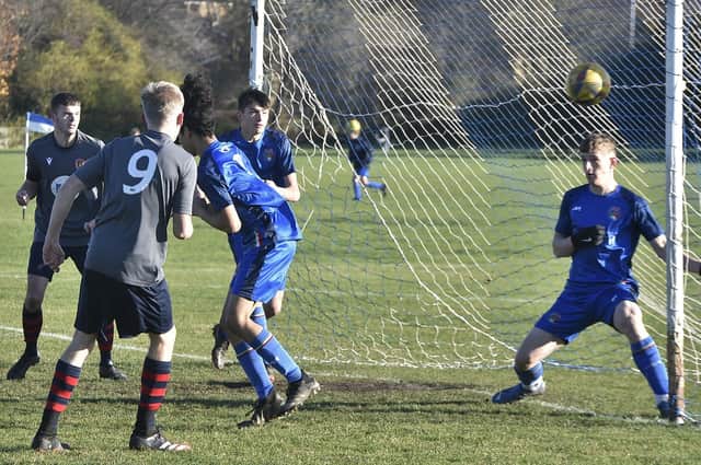 Harvey Henderson (9) scores the only goal of the game for Deeping United 18s against ICA Sports. Photo: David Lowndes.
