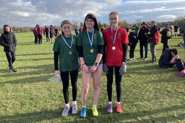 AMVC enjoyed a clean sweep in the Intermediate Girls race with Lola Fletcher (centre, first), Olivia Walker (second) and Katie Gee (third).