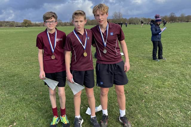 The 1-2-3 in the Junior Boys race. Leo Douglas of King’s (centre, first), Freddie Muir of King’s (right, second) and Charlie Jefrie of Stanground (third).