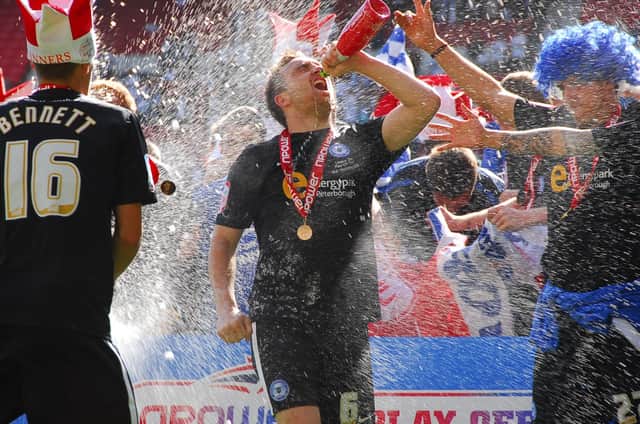 Posh's Charlie Lee celebrates after the 2011 League One play-off final win at Old Trafford.