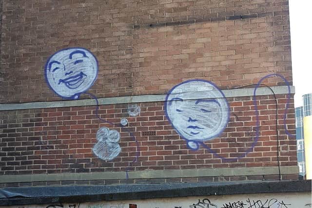 Street art in the alleyway between Cattle Market Road and Broadway. Photo: David Lew.