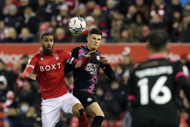 Ronnie Edwards of Peterborough United in action with Lewis Grabban of Nottingham Forest. Photo: Joe Dent/theposh.com.
