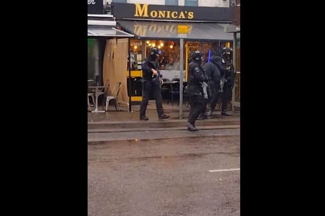 Armed police officers in Lincoln Road. Pictures from social media.