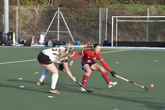 Hockey action from City of Peterborough Ladies (red) draw with Harleston in the East Premier Division. Photo: David Lowndes.