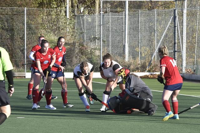 Hockey action from City of Peterborough Ladies 1sts (red) v Harleston 2nds at Bretton Gate. Photo: David Lowndes.