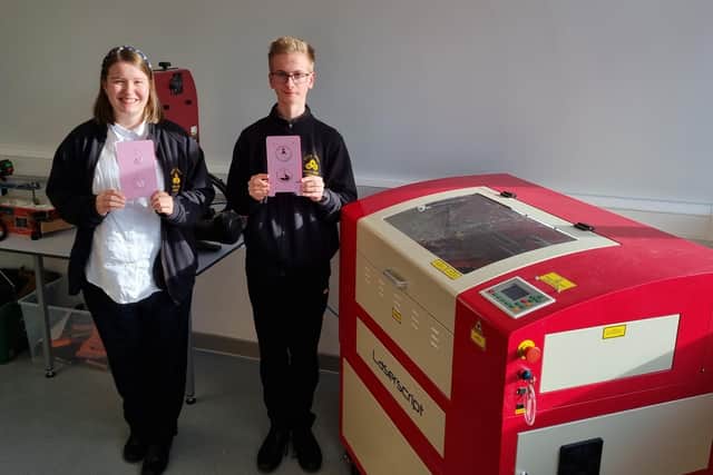 Students, Zoe and Daniel are excited for the new 3D printer.