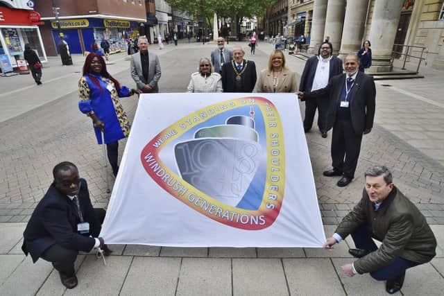 Mayor of Peterborough Steve Lane and Mayoress Margaret Lane with council and community representatives at the Windrush Day flag raising ceremony outside the Town Hall in June this year.