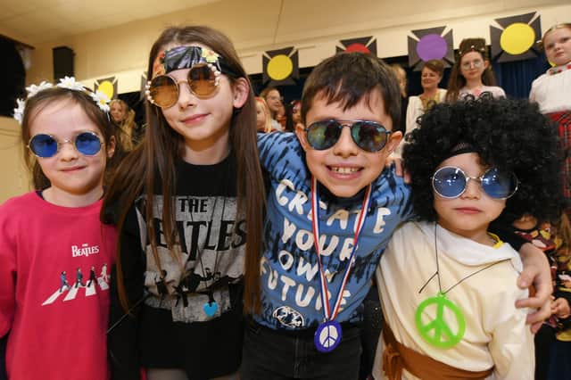 Werrington Primary School  pupils and staff dressed in 1960's outfits to celebrate the school's birthday.