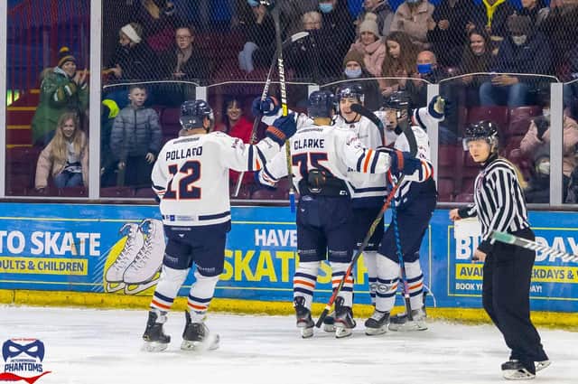 Jasper Foster (third left) celebrates his goal for Phantoms against Bees with from left, Nathan Pollard, Ross Clarke and Billy Thorpe. Photo: Darrill Stoddart.