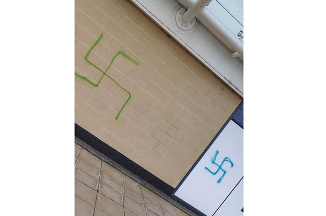 Two swastikas were sprayed onto a wall at Brotherhood Shopping Park.