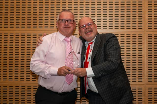 Dave Thomas, regional sales manager at FASTSIGNS Peterborough with Mark Jameson, chief support and development officer at FASTSIGNS based in the Dallas HQ, who presented the award.