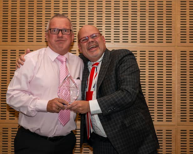 Dave Thomas, regional sales manager at FASTSIGNS Peterborough with Mark Jameson, chief support and development officer at FASTSIGNS based in the Dallas HQ, who presented the award.