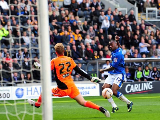 Emile Sinclair scores his second goal of a hat-trick for Posh at Hull City in a Championship fixture in September, 2012.