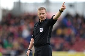 Referee John Busby.