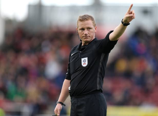 Referee John Busby.