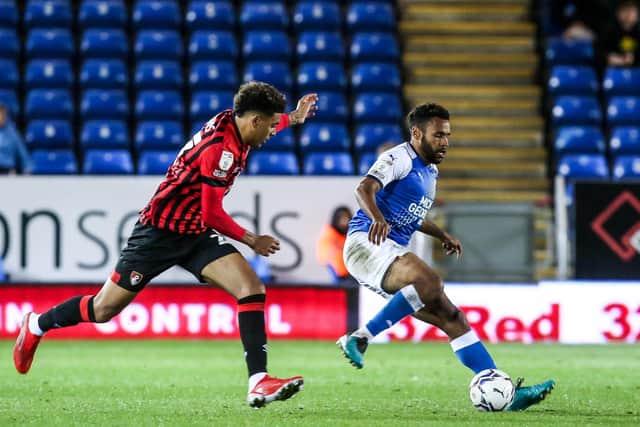Posh defender Nathan Thompson takes on Morgan Rogers of Bournemouth in September.