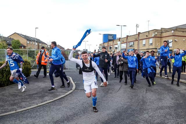 Academy graduate Harrison Burrows celebrates promotion from League One last season. Photo: Joe Dent/theposh.com.