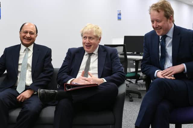 Prime Minister Boris Johnson with MPs Shailesh Vara and Paul Bristow during a visit to the Peterborough Telegraph.