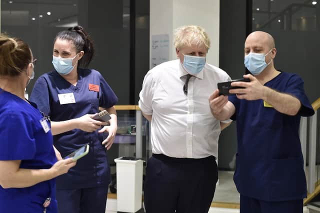 Prime Minister Boris Johnson visiting the vaccination centre at the Queensgate shopping centre. EMN-220601-185555009