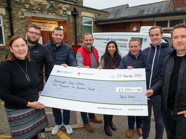 Directors from Barratt and David Wilson Homes' present Peterborough Soup Kitchen with a cheque. Photo: Steve Baker.
