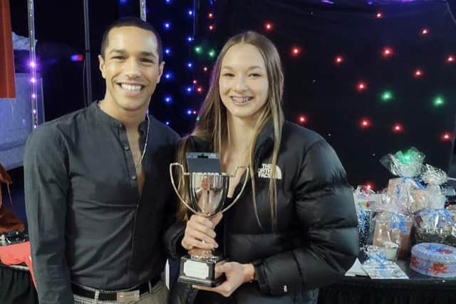 COPs female swimmer of the year Hannah Willis with Michael Gunning.
