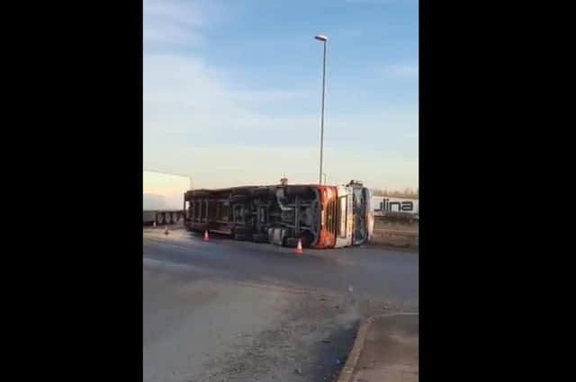 The overturned lorry on the A605.
