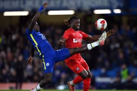 Kabongo Tshimanga (red)  of Chesterfield in action against Chelsea at Stamford Bridge last weekend. (Photo by Justin Setterfield/Getty Images).