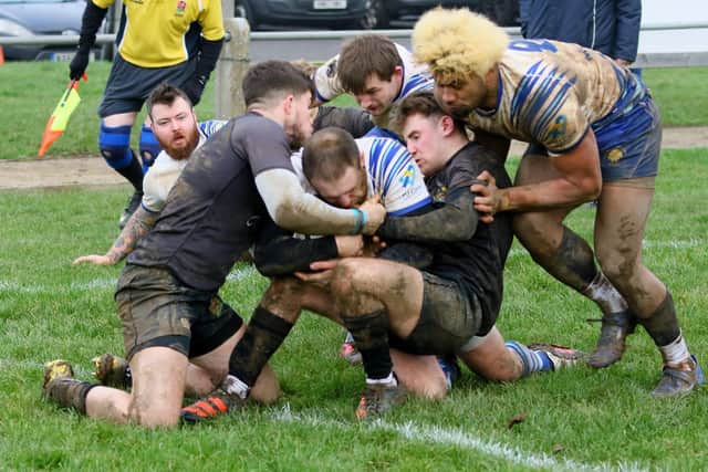 Charles Frankham of Lions is held up on the Market Harborough tryline in the final moments of the game. Photo: Mick Sutterby.